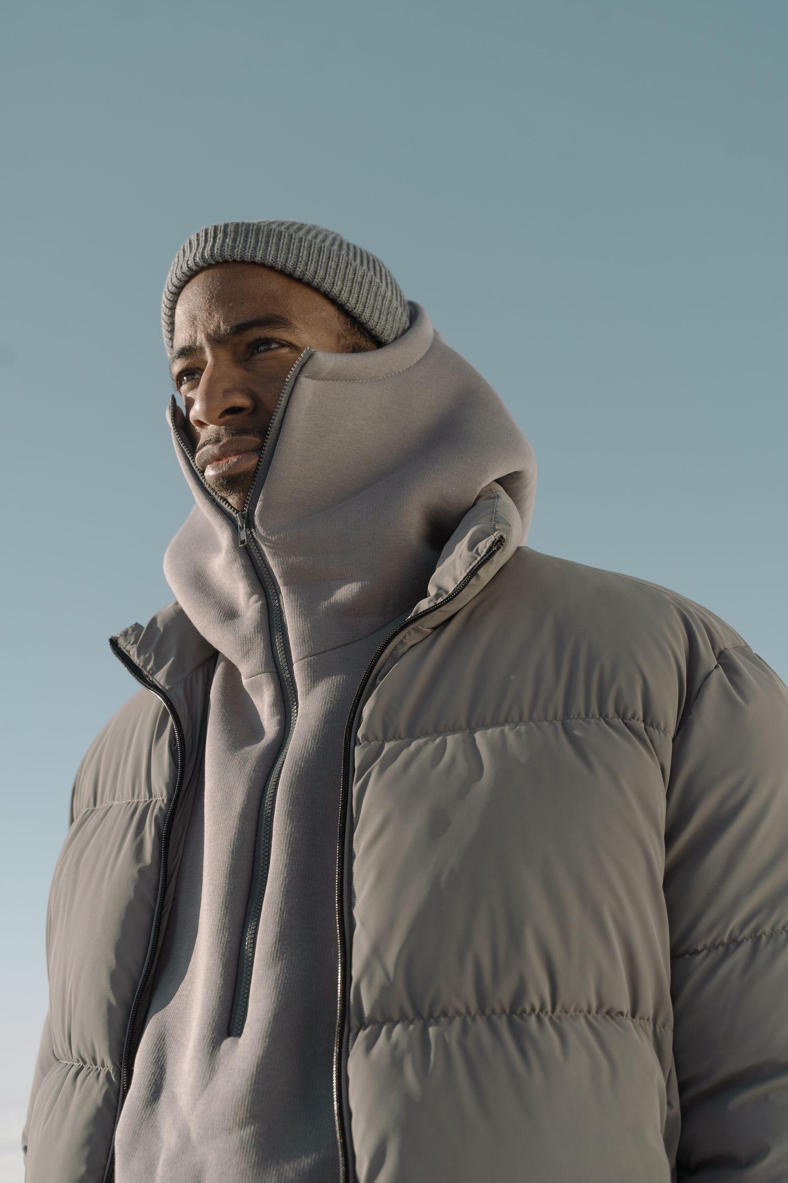 A quilted jacket, worn with a hood