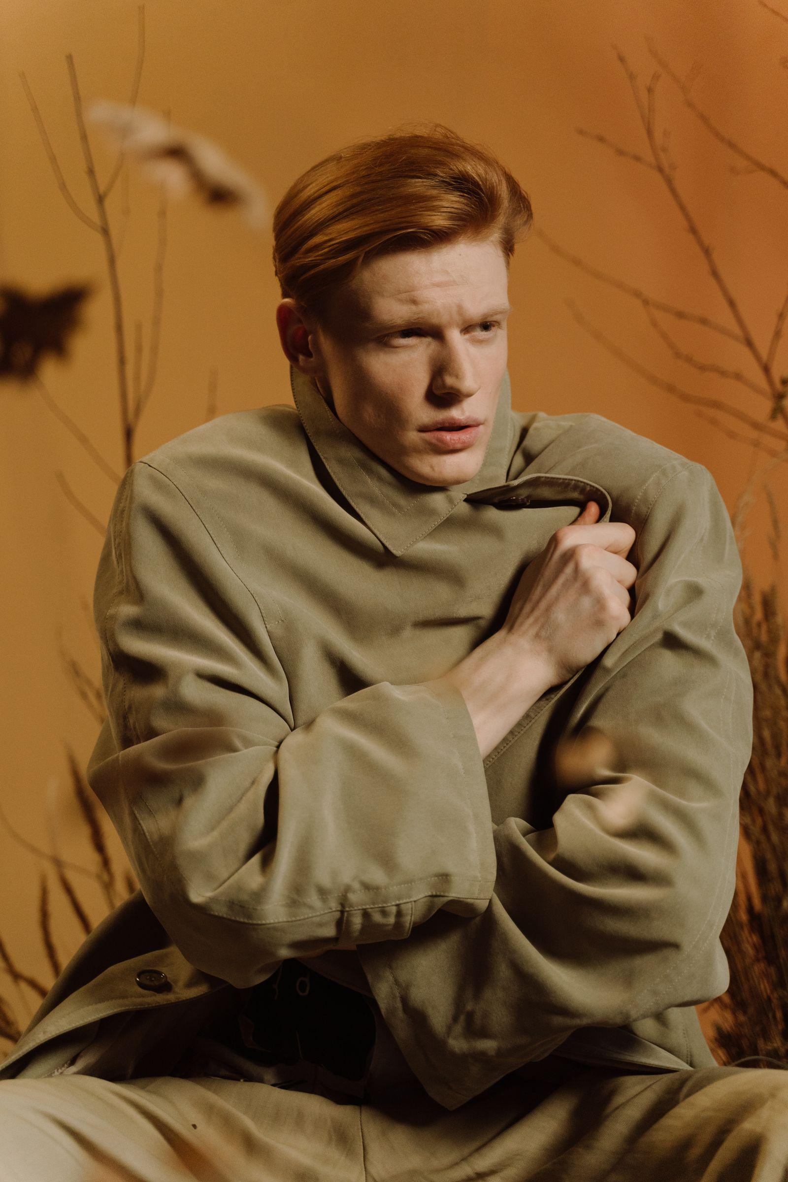 A men's coat, worn outdoors