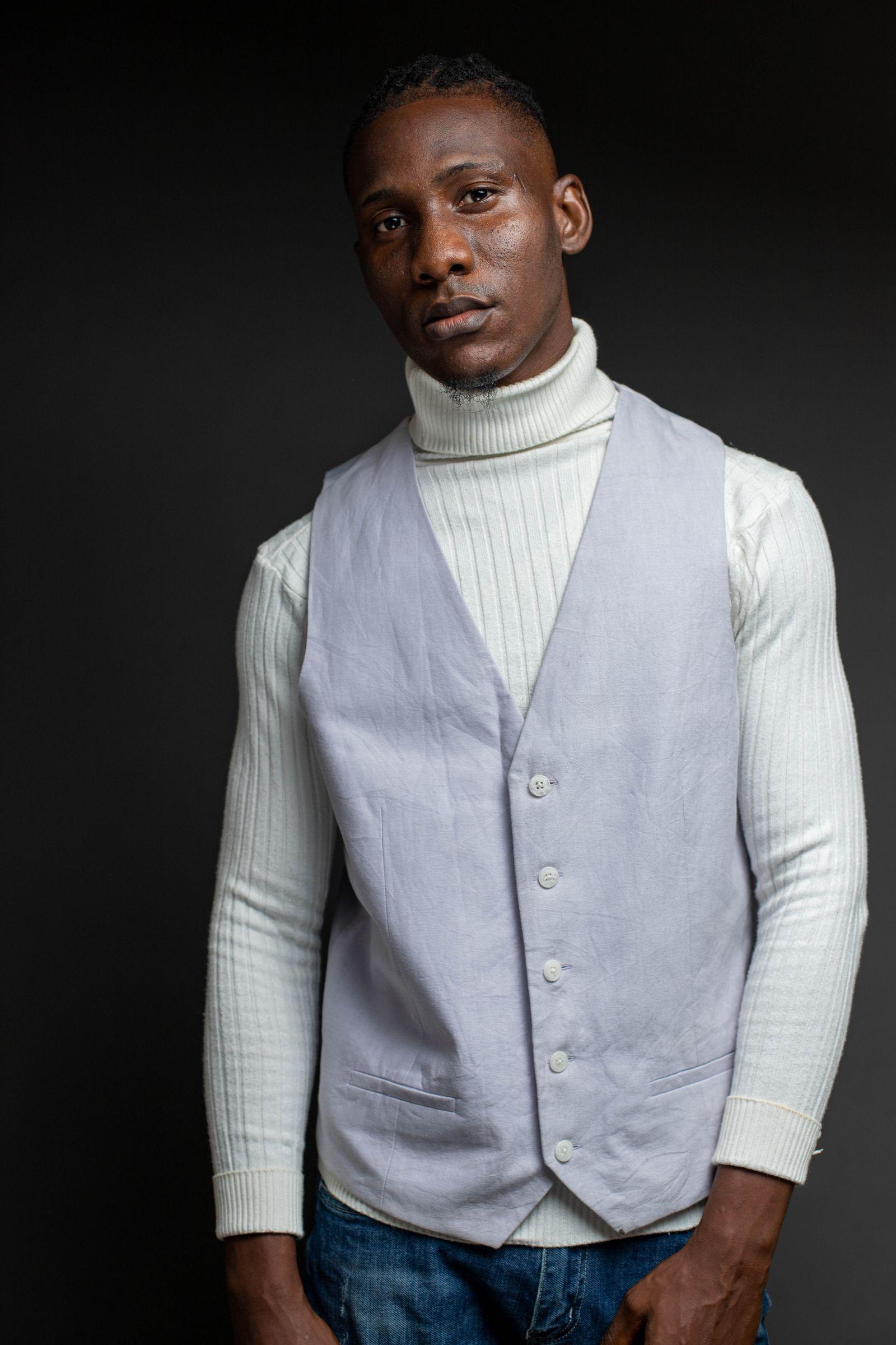 A turtleneck layered under a waistcoat