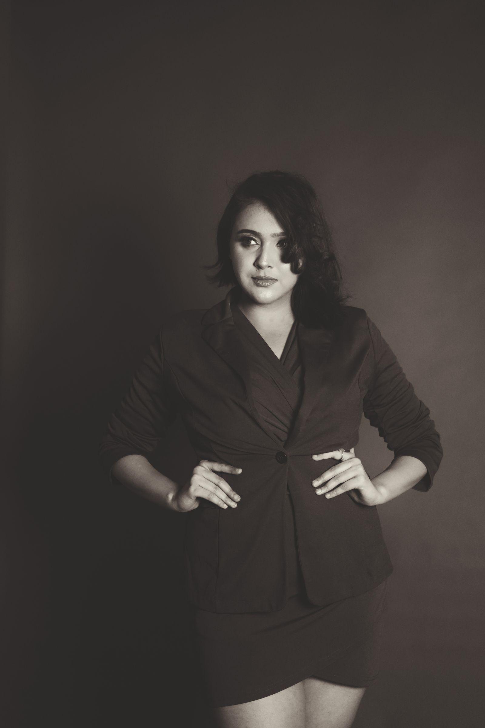 A blazer worn over a dress